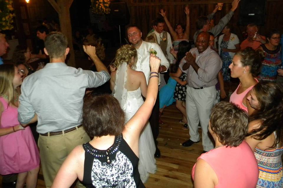 Couple dancing with their guests