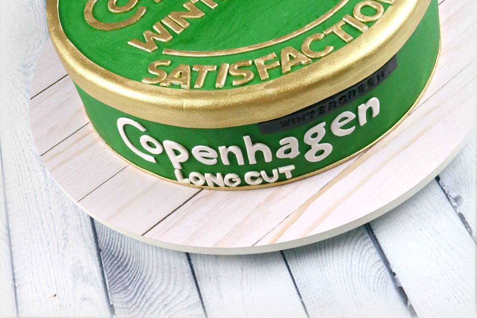 Green ckae with gold lettering