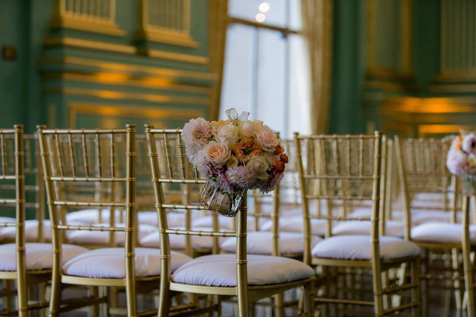 Rustic chair decorated with floral arrangement