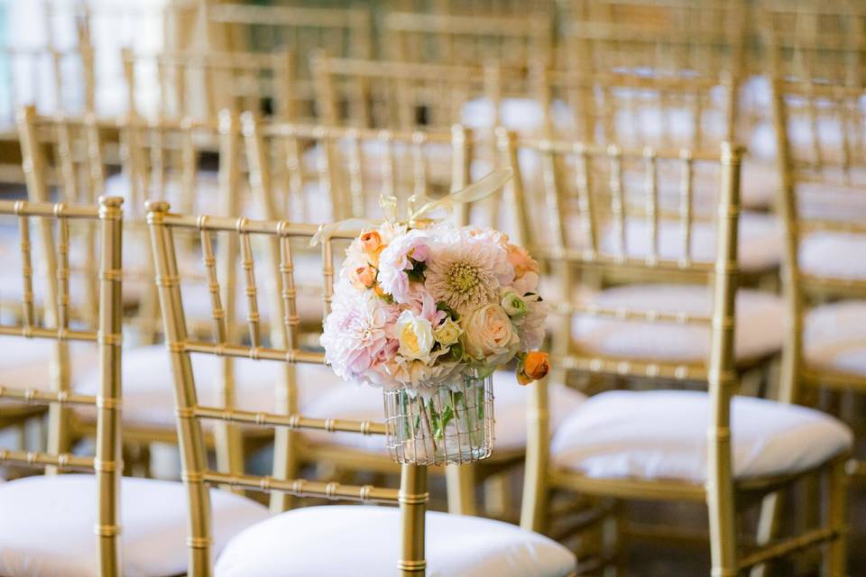 Rustic chair decorated with floral arrangement