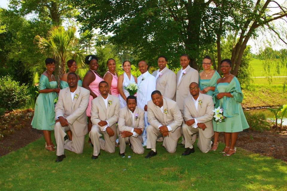 The couple with the bridesmaids and groomsmen
