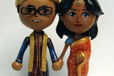 Topper based on user created Miis from the Nintendo Wii, in actual wedding attire.  Traditional Indian wedding.