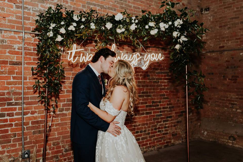 Mr and Mrs with neon sign