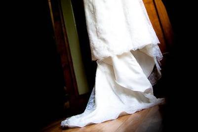 Bride's wedding gown hangs at Glenwood's Redfield Estate.