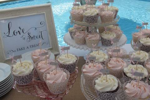 Pink and White Frosted Wedding Cupcakes with edible pearls, lace cupcake wrappers and little 