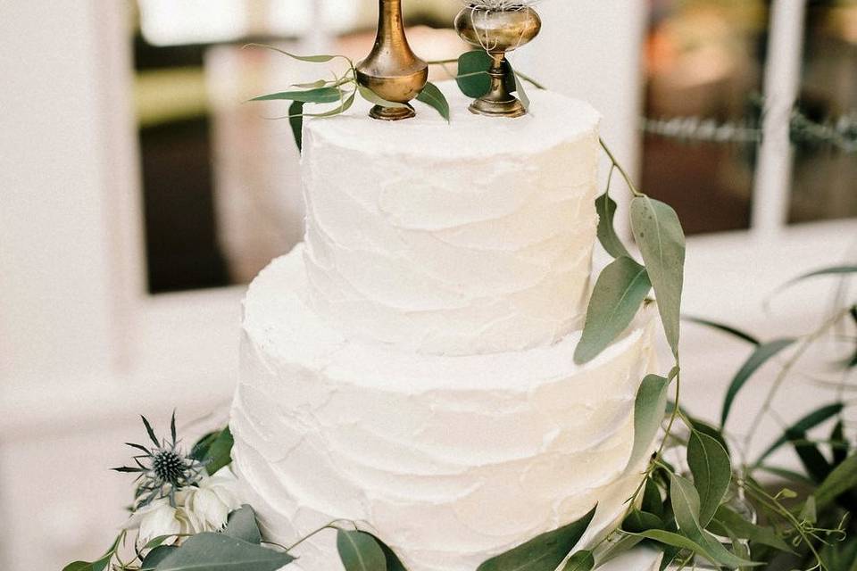 Boho Wedding Cake with rustic buttercream frosting and unique toppers with air plants by Let's Do Cake!