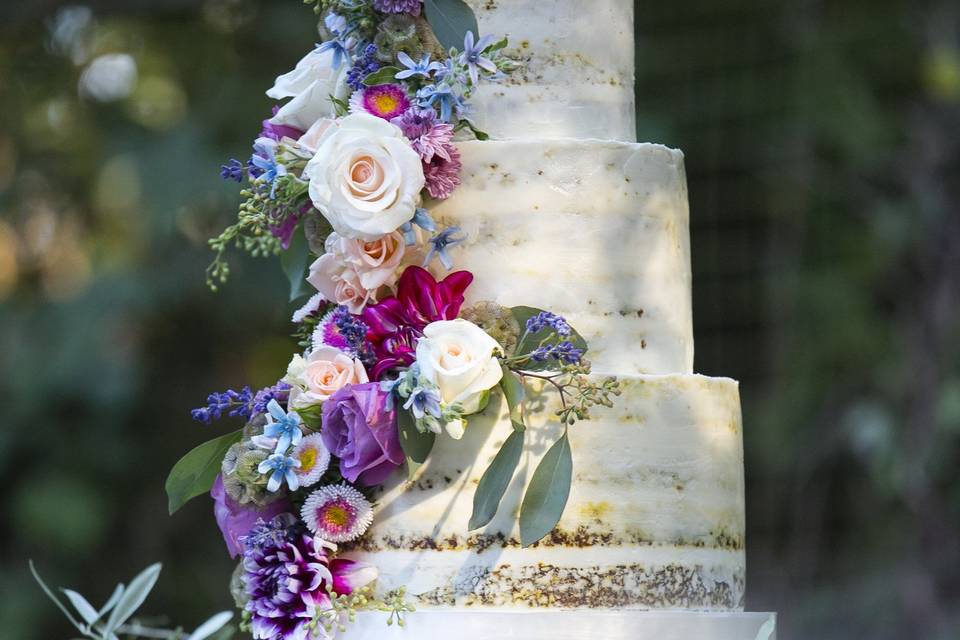 Semi Naked Carrot Wedding Cake with fresh flowers put on by us, Let's Do Cake!