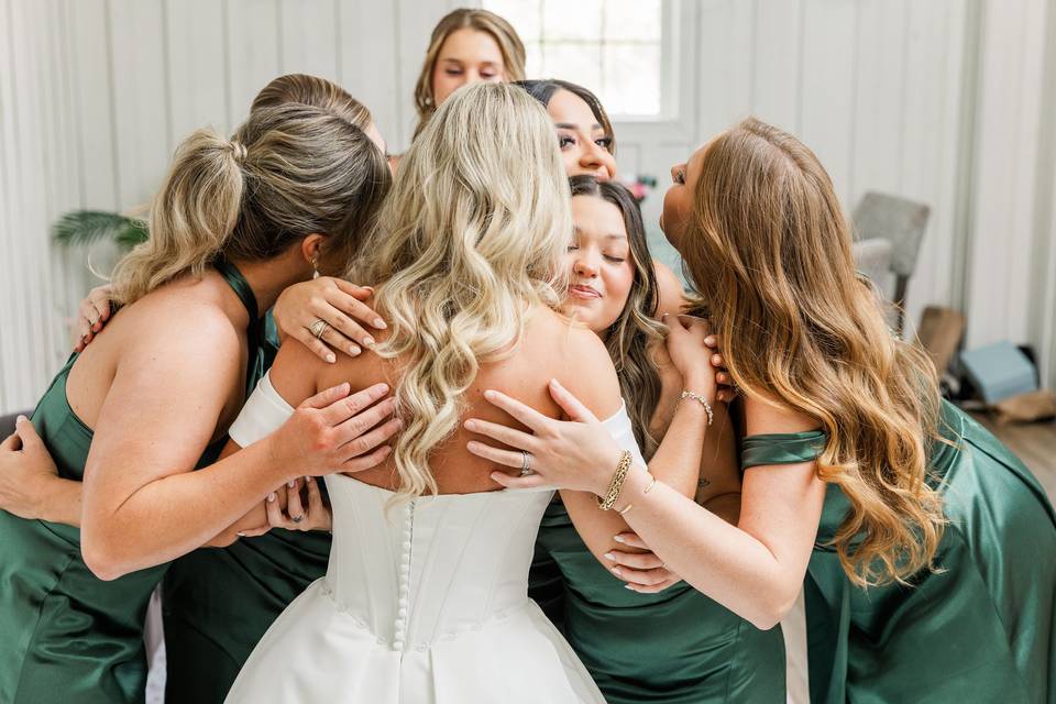 Bridal party hug