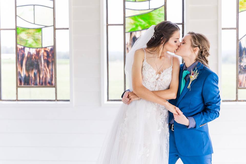 Brides kissing