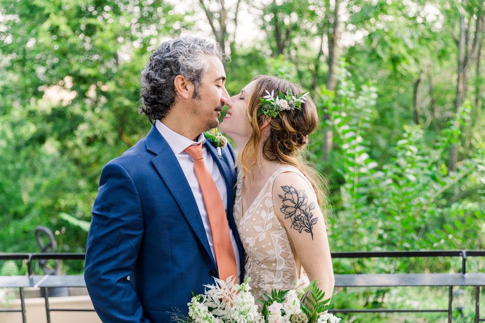 Newlywed kissing portrait