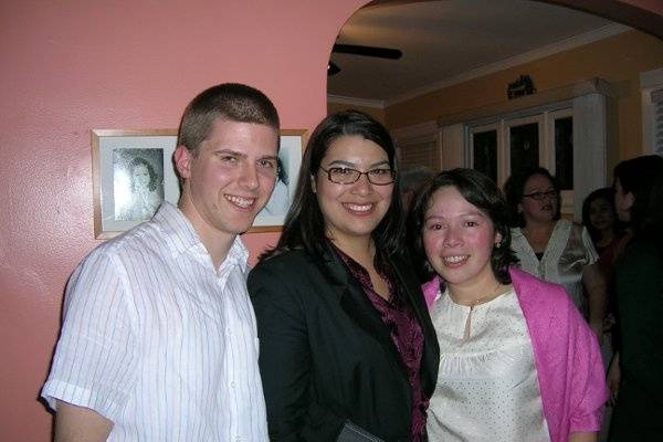 The newlyweds with the wedding officiant