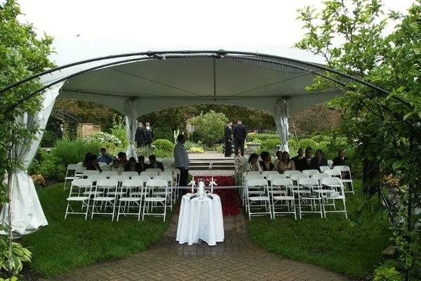 The newlyweds with the wedding officiant