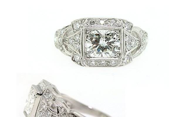 Vintage reproduction created by Jill Lynn. This ring features a 1.06ct cushion cut diamond, accented with pave set round brilliant cut diamonds and millgrain detail.