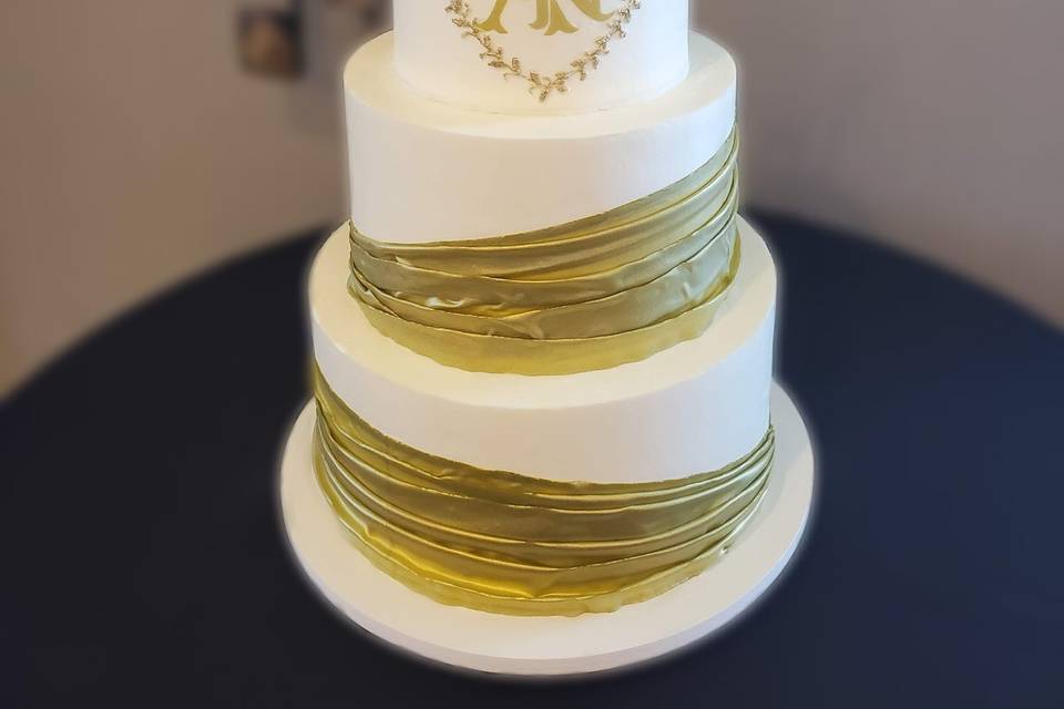 Gold edible fabric draped cake