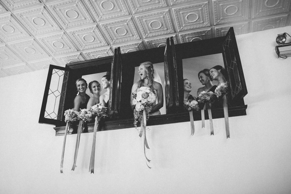 Bridal party by the windows