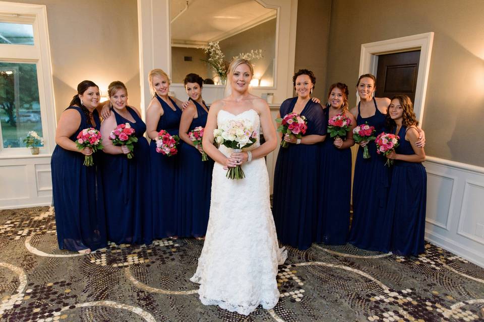 Bride with her maid of honor and bridesmaids