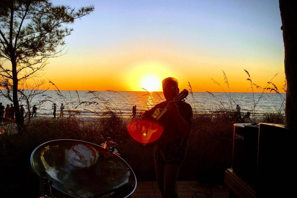 Guitar and steel drum at sunset