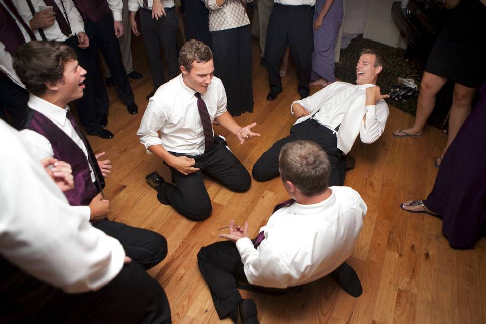 Groom and groomsmen dancing