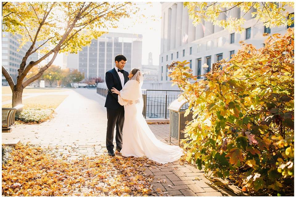 Newlyweds embracing in a park