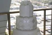 All white wedding cake with white bow