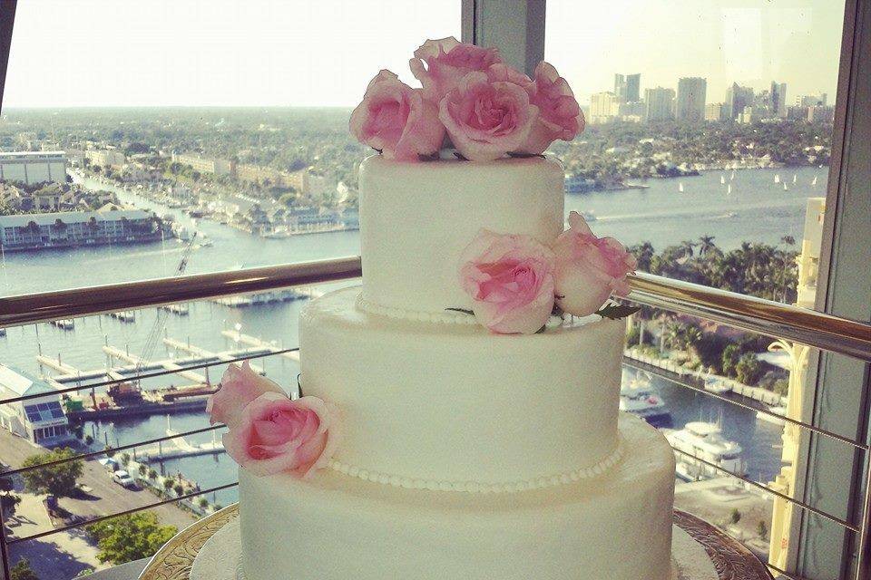 Simple wedding cake with pink flowers