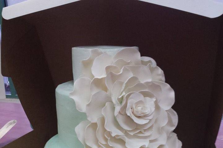 Simple wedding cake with pink flowers