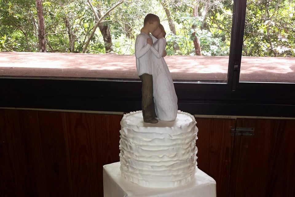 Wedding cake with figurine on top