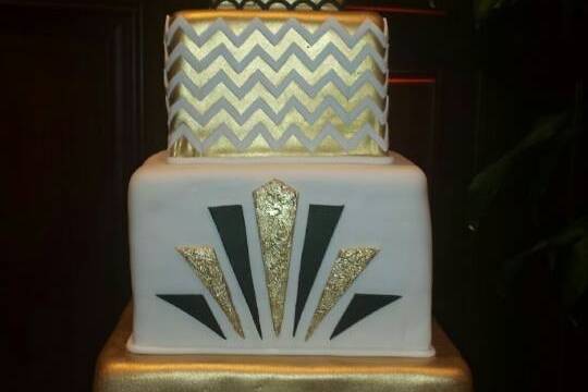 Fancy wedding cake with gold bottom layer