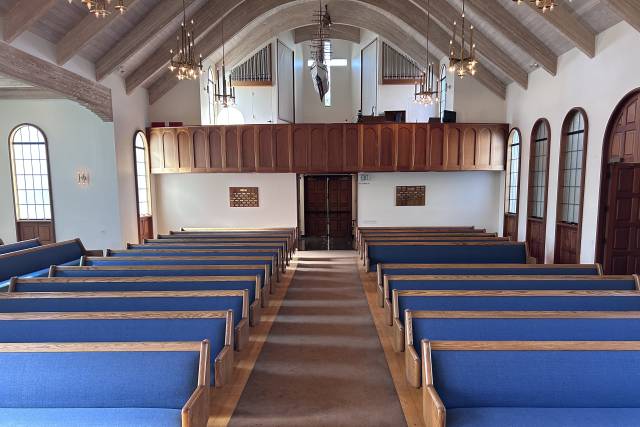 New blue pews and oak floors