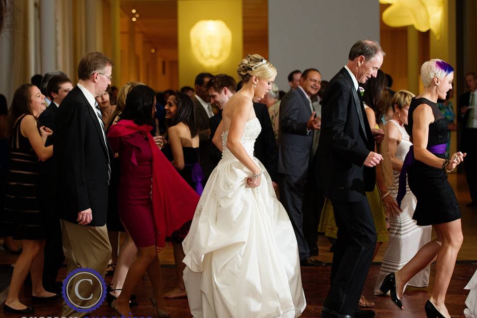 Dancing bride and guests