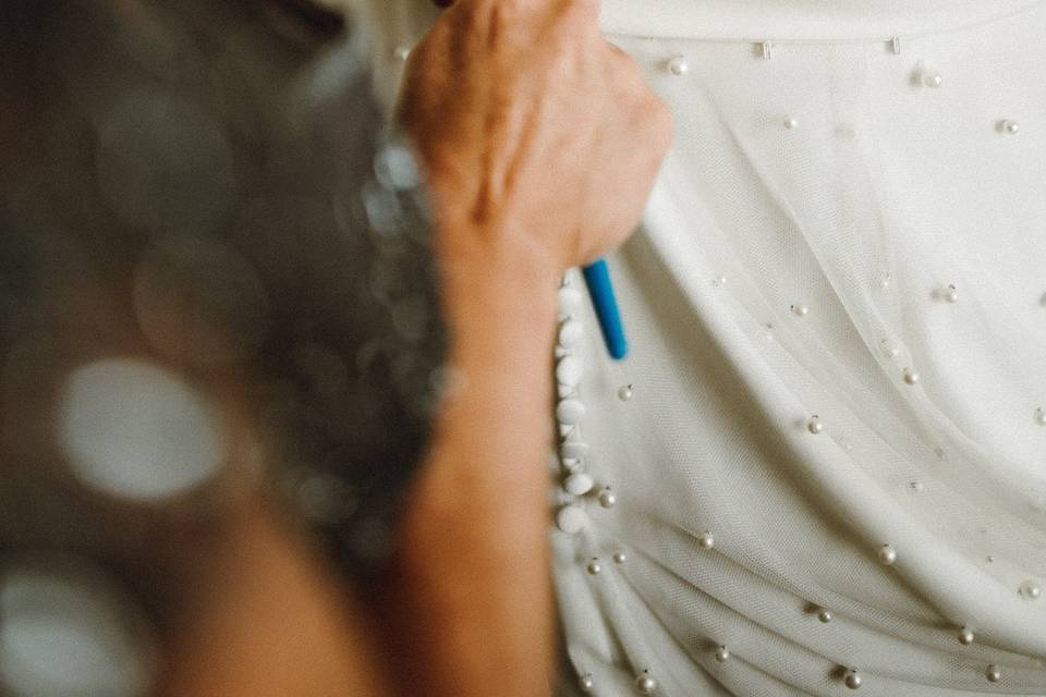 Buttoning the Dress