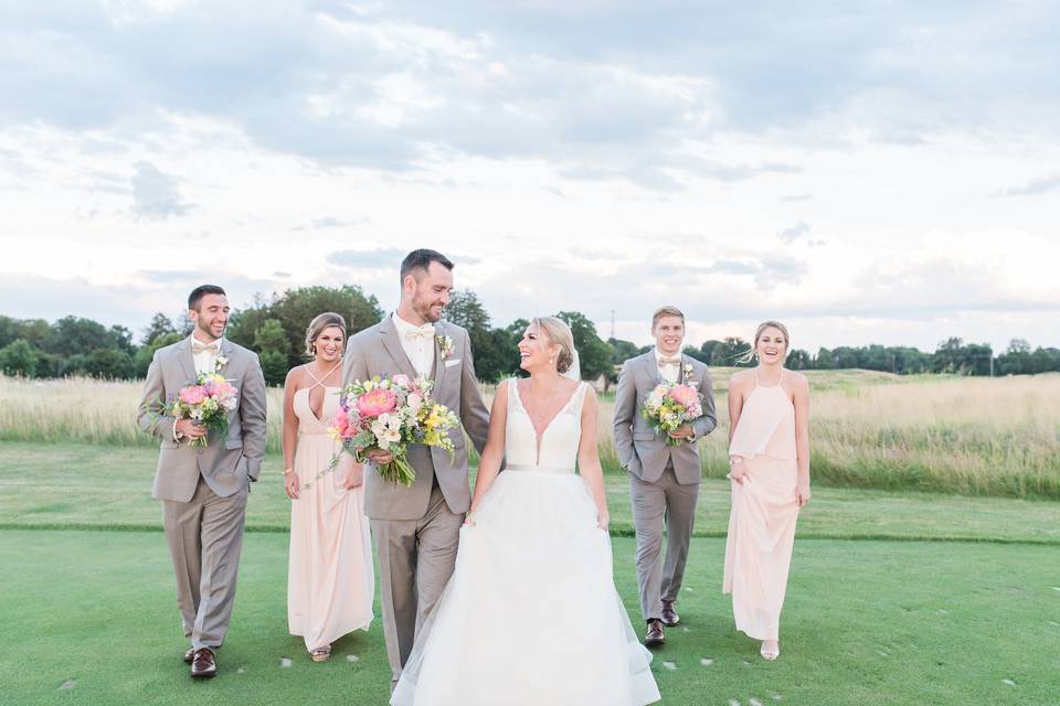 The newlyweds with the wedding attendants