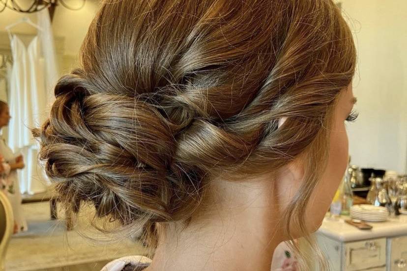 Low curly bun style