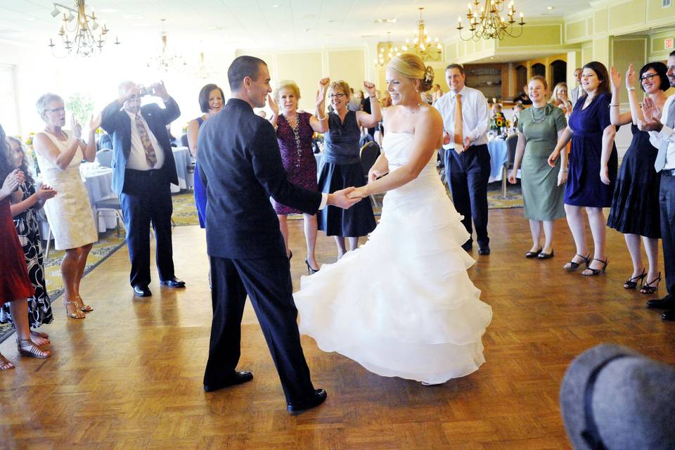 The bride and groom dance