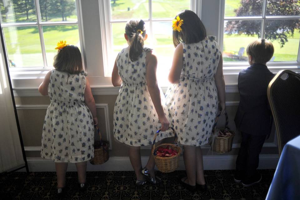 The flower girls and ring bear wait for their big moment.
