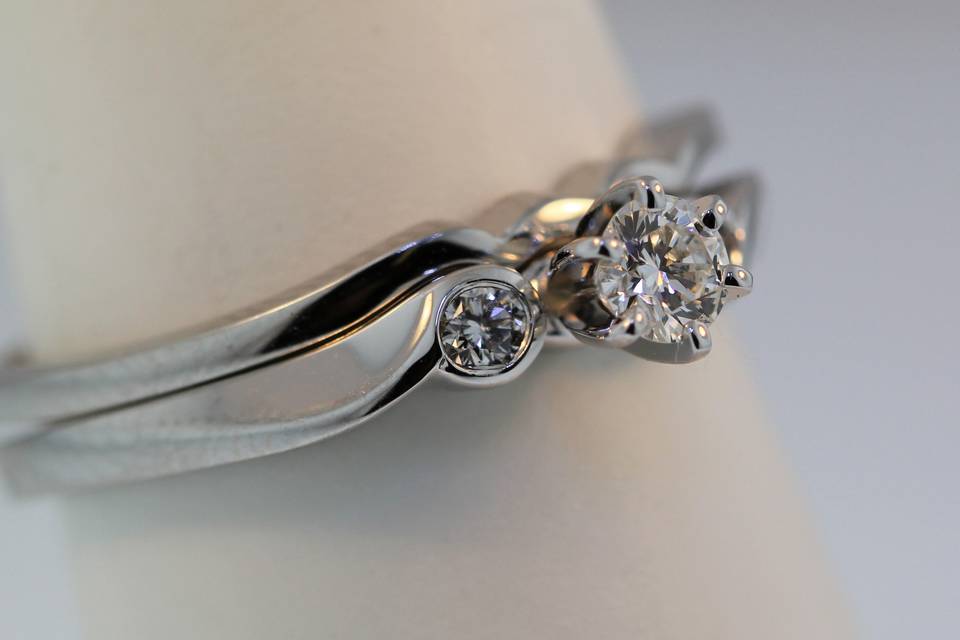 14k white gold three stone diamond engagement ring with matching wedding band. We can set any shape or size center stone into this ring. We can also make it in yellow gold or platinum