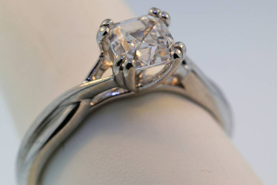 twist on the traditional solitaire diamond engagement ring. antique style split prongs hold in the center diamond. As pictured one GIA D VS2 1.02ct assher cut.
$16,000.00
We can make this style with any shape or size center stone, including colors, in any color gold or platinum
.