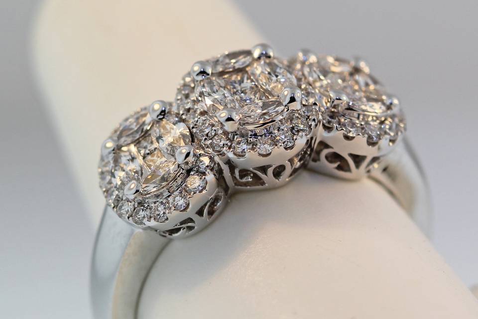 18k white gold diamond cluster engagement/right hand ring with oval and round diamonds. total carats weight is 1.02 carats. $5,700.00