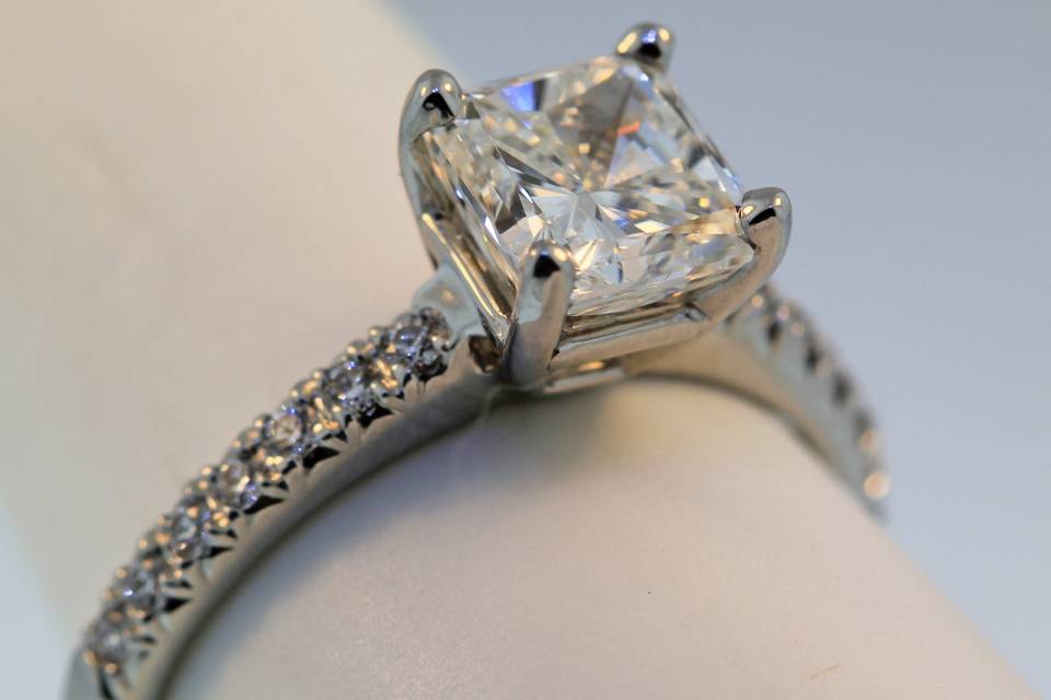 platinum engagement ring with 1.51 carat princess cut diamond. The sides have .15cts total weight in round diamonds. $20,000.00