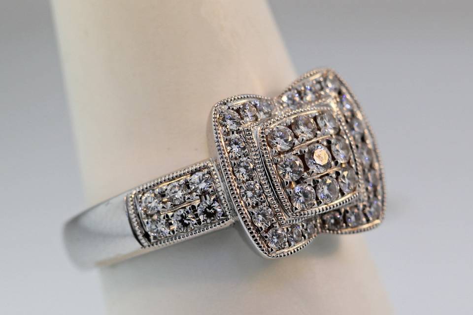 18k white gold diamond cluster engagement/ right hand ring. With .63 carats in diamonds. $4,500.00