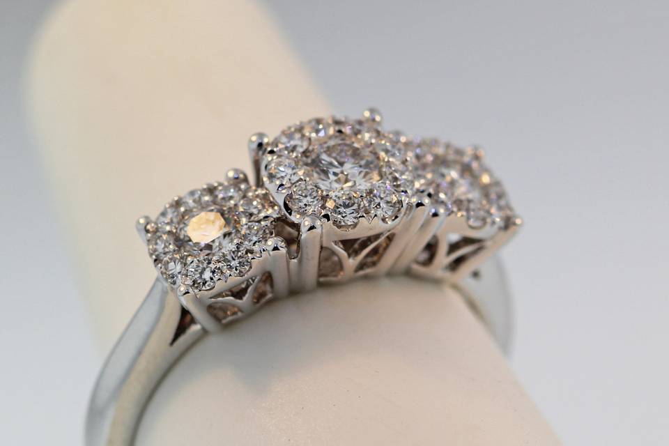 Three stone diamond cluster engagement/right hand ring. 18k white gold with .78 carats in diamonds $5,000.00