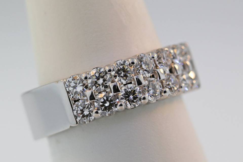 14 karat white gold diamond wedding band/ right hand ring. Two rows of shared prong diamonds weighing 1.15 carats. $6,000.00