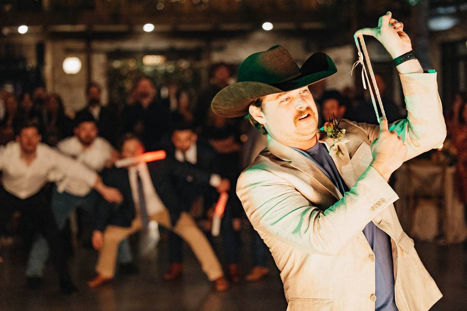 Groom tossing the garter