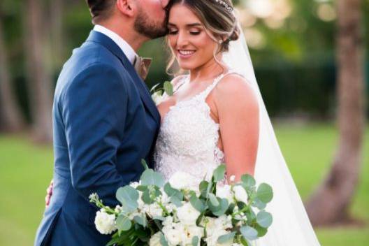 Groom kissing his bride