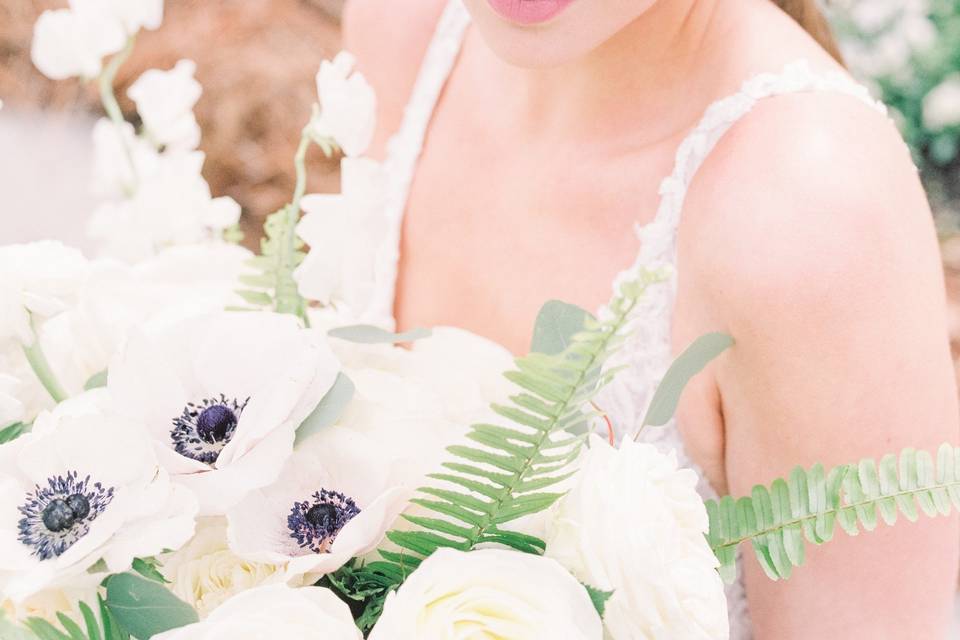 Bride Looking at Bouquet