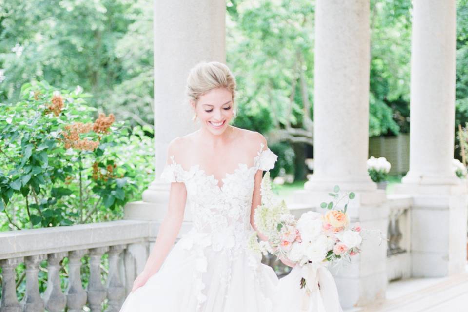 Bride holding dress