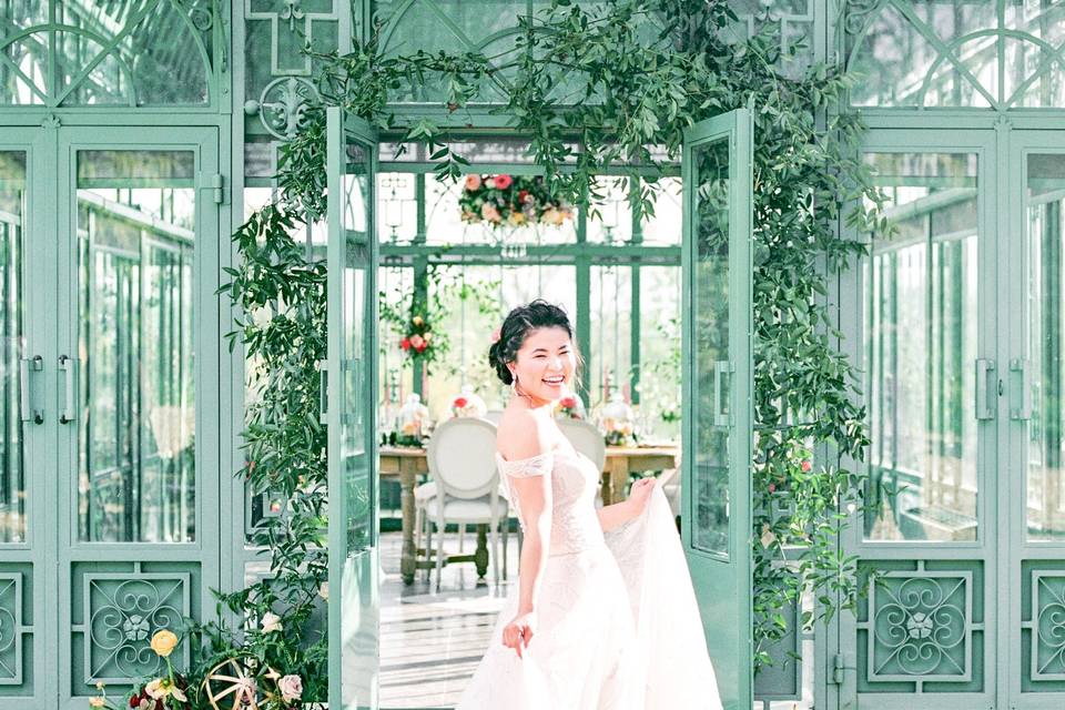 Bride in front of Green House