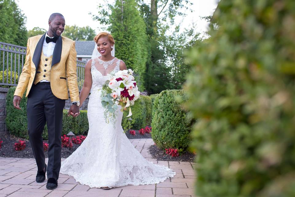 Stylish bride & groom walking