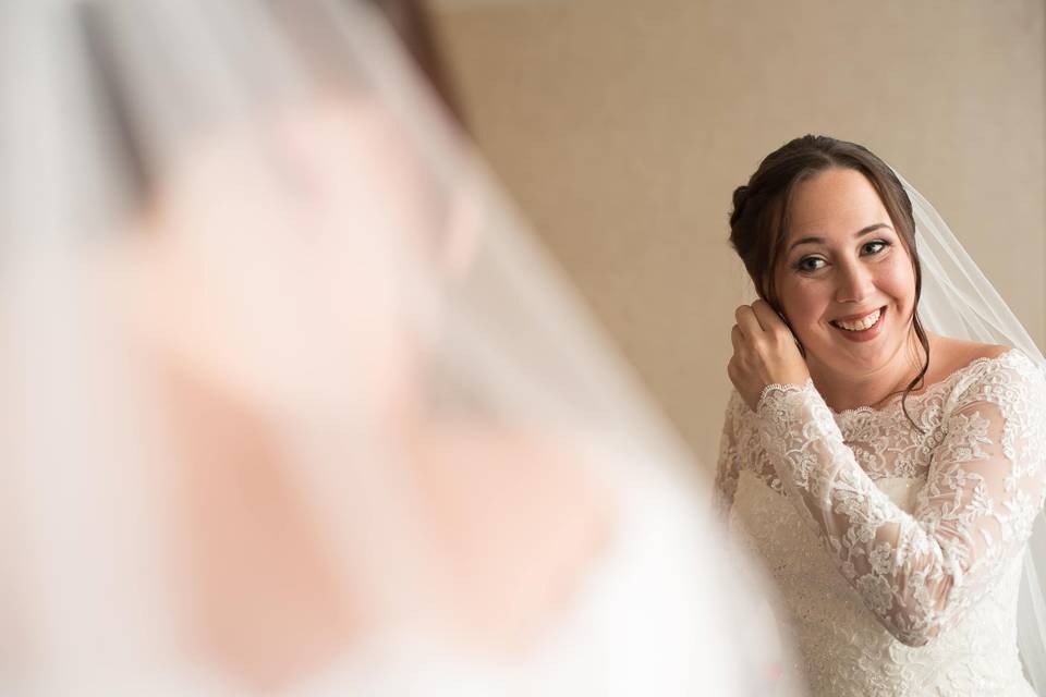 Bride looking in mirror