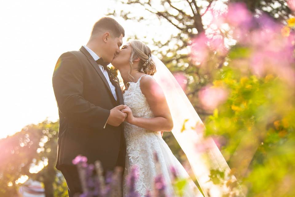 Golden hour kiss with flowers